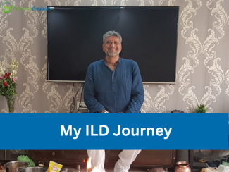A middle aged man in a blue kurta and white pyjama sitting in front of a TV screen and text overlay on a blue strip My ILD Journey