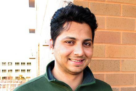 Profile pic of Sagar Shanbag, a young man with green polo tshirt with a profile brick wall in the background