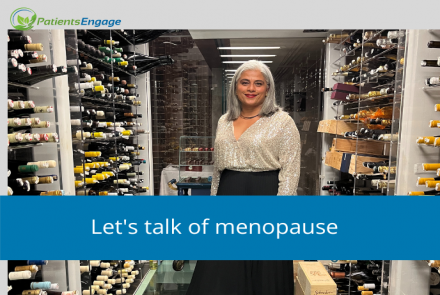 A woman in a white shirt and black skirt standing in a wine store and text overlay Lets talk of menopause on a blue strip 