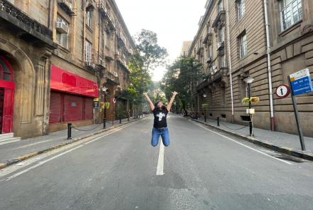 The author shormishtha jumping in the middle of a road 