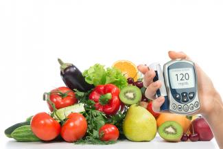 Glucometer and a tray of fruits