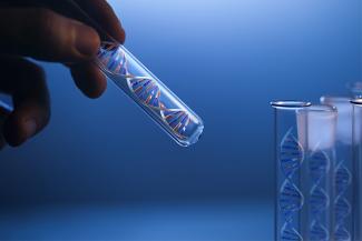 Stock pic of a hand holding a test tube with a DNA helix inside it signifying genetic testing 