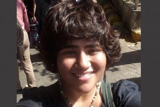 Mamta Prasad, short haired head shot in an outdoor setting 