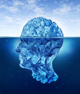 An bluish image of a head submerged in liquid 