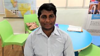 Sandeep is an Ewing Sarcoma survivor and is currently a Patient Navigator. Here he is sitting in a colourful play room for children with cancer