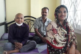 A child with cancer with his parents