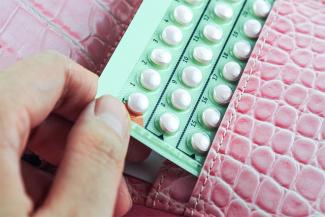 Image shows a strip of pills meant to be contraceptive pills