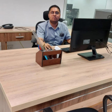 Mohit Gupta at a work desk in front of a computer screen