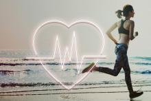 Stock pic of a young women running on the beach with an overlay of a heart and ECG