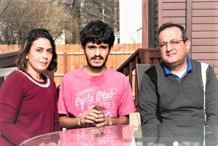 Image: Left to Right. On the Left is Harshita the mom in a red dress, in the center is Sahil in a pink T Shirt and the on the right is the father in a green shirt