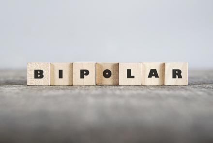 A stock photo with scrabble tiles arranged with the word BIPOLAR