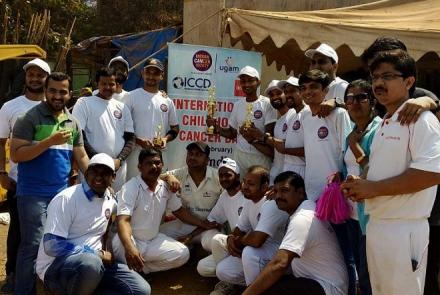 Cricket teams posing at the cricket game to spread childhood cancer