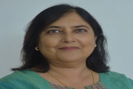 Profile picture of Daksha Bhat, a dementia information advocate in a green top