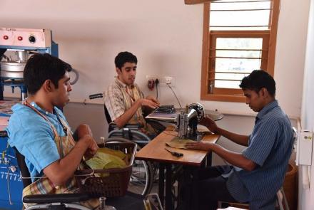 3 young men including Sriram and Sunder at work in the factory