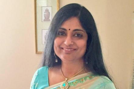 Image: Smiling woman wearing a sari looking at the camera tells her fibromyalgia story