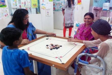 A picture of childhood cancer patients playing carrom  
