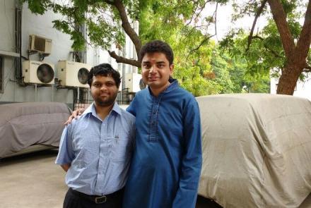 Image: Bharat in a blue kurta and Viraj in a light shirt together against an outdoor setting. Both are diagnosed with Asperger's syndrome and work in development in SAP Labs