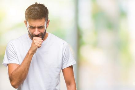 A man coughing and looking for ways to Improve lung function