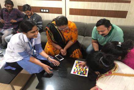 Dietician Navnidhi Vyas playing the game with waiting families of the patient