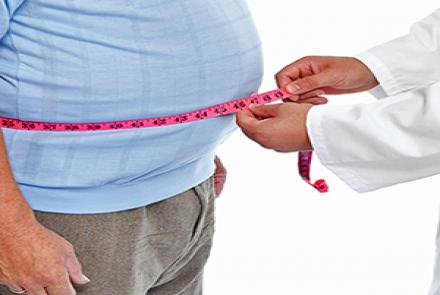 Image: A person with a measuring tape around an expanded waist signifying obesity