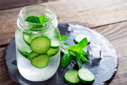 Image of a jar of water with cucumber and mint. Risk of Dehydration in Winter